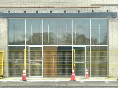 Newly installed doors are the Niagara Pen Centre with yellow construction fencing surrounding them.