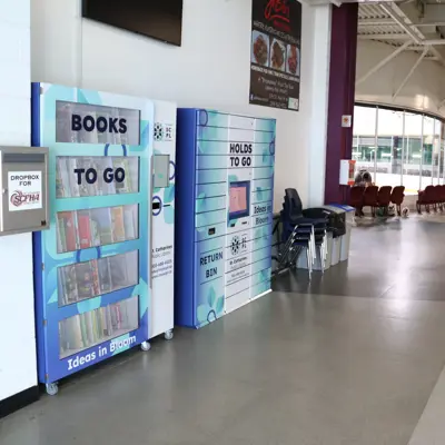 Books-To-Go and Holds-To-Go lockers at the entrance of the Seymour-Hannah Sports and Entertainment Centre.