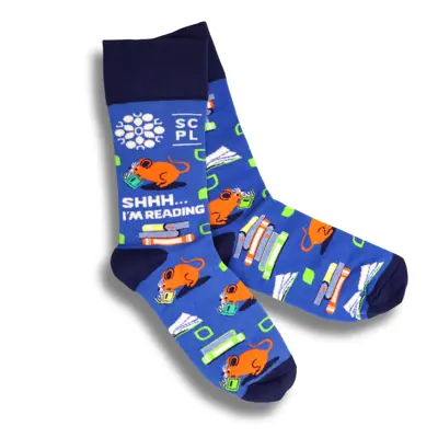 Blue socks featuring the library mouse and text that reads "Shhh...I'm Reading".
