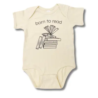 A cream coloured, short-sleeved baby onesie featuring a stack of books and the phrase "Born to Read" above the books.